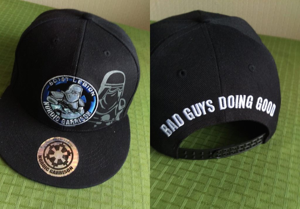 Black baseball cap with the text "Bad guys doing good" on the back and the Nordic Garrison logo on the front.