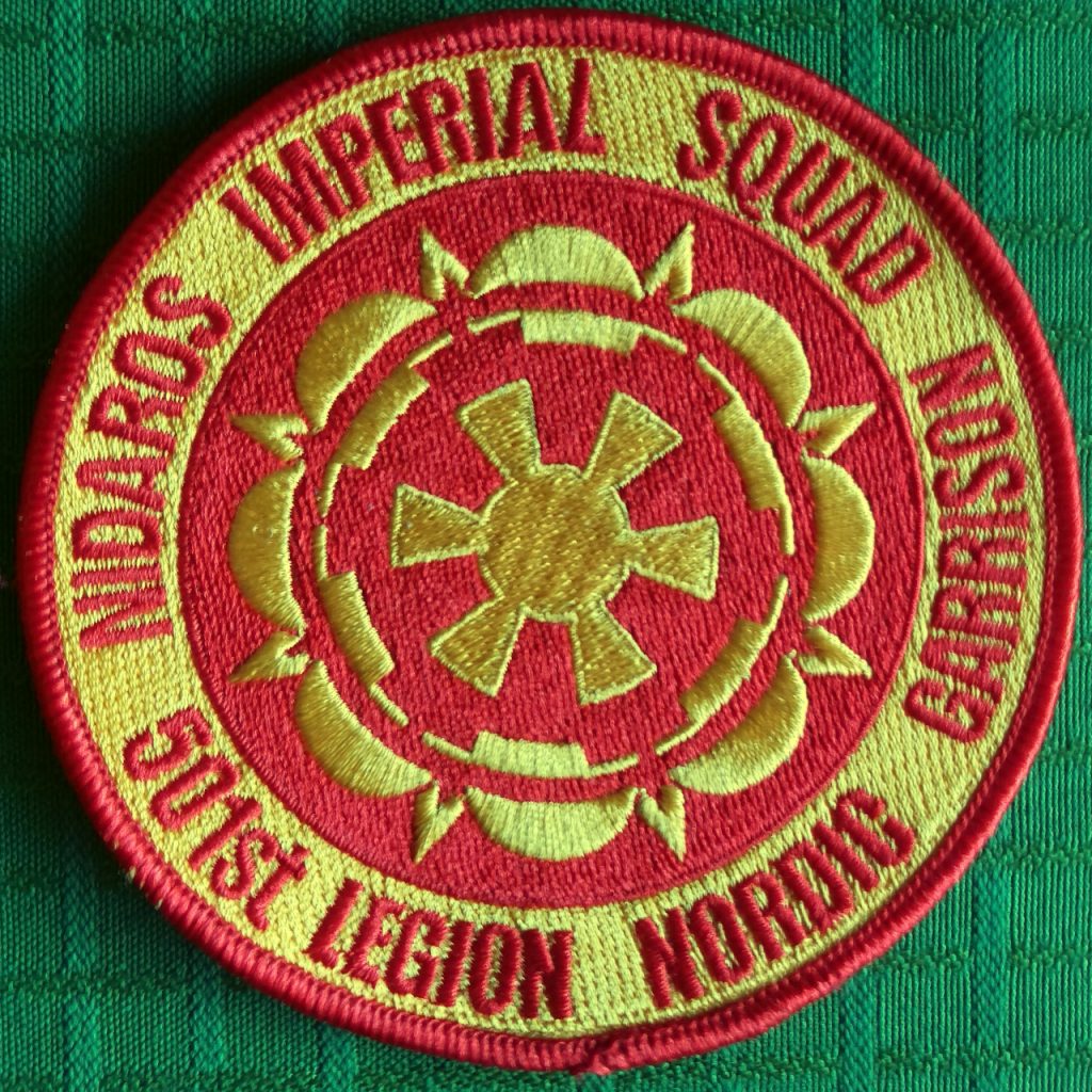 A red and yellow embroidered round patch with the text "Nidaros Imperial Squad" "501st Legion" "Nordic Garrison" around the edge.