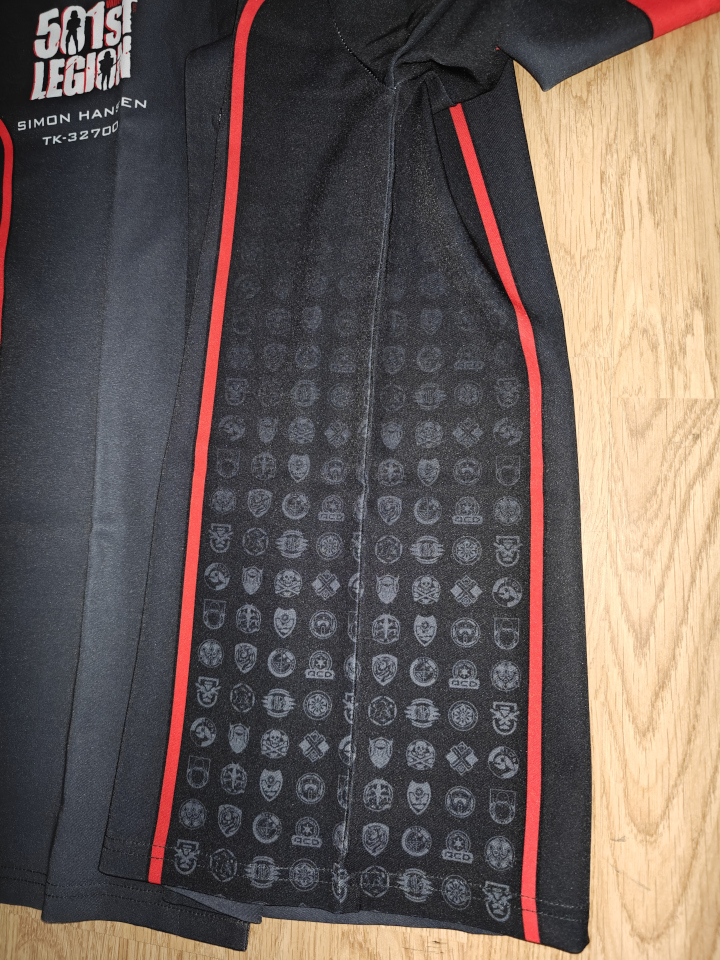 Close-up of the side detail. The symbols are the various detachment logos in the club, arranged in a grid-like pattern.