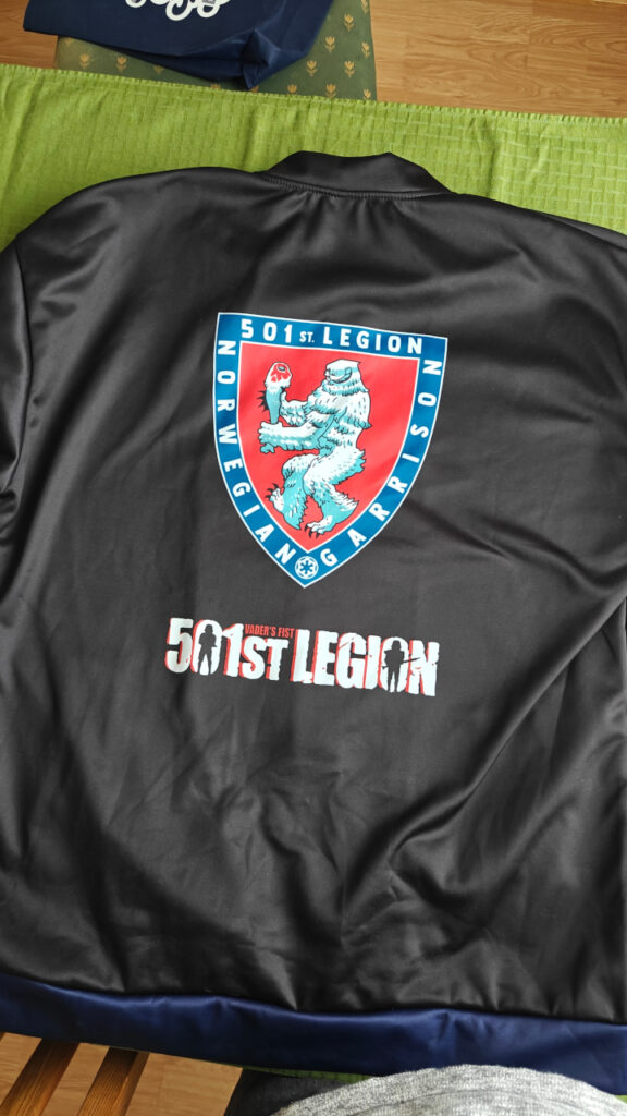 The back of the jacket has a larger garrison logo and the 501st letter logo.
