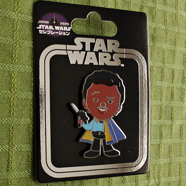 A cartoonish Lando Calrissian as a pin.